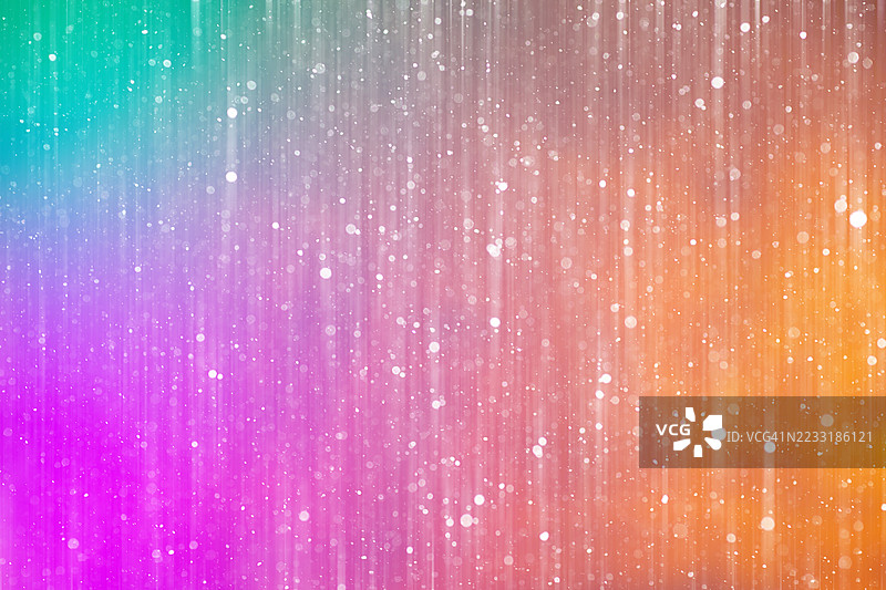 抽象渐变背景，伴随飘落的雪花和明亮的彩色灯光图片素材