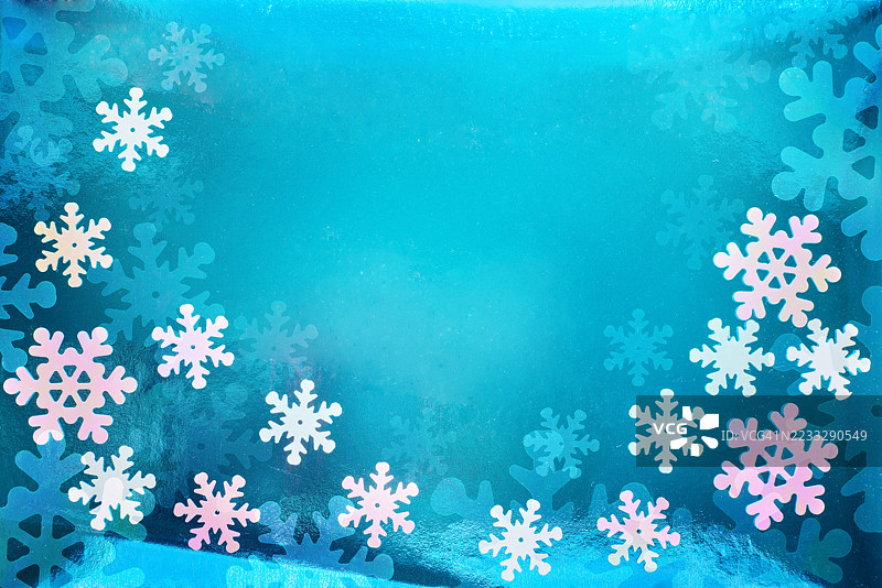 在蓝色背景上形成的雪花圣诞框架图片素材