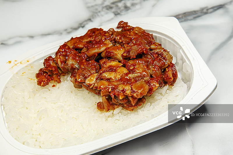 蒸米饭上的蜗牛泡菜图片素材