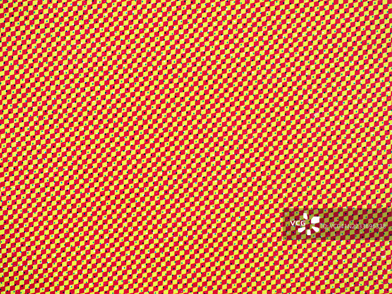 黄色和红色的小方块上有绿色和黑色的点。图片素材