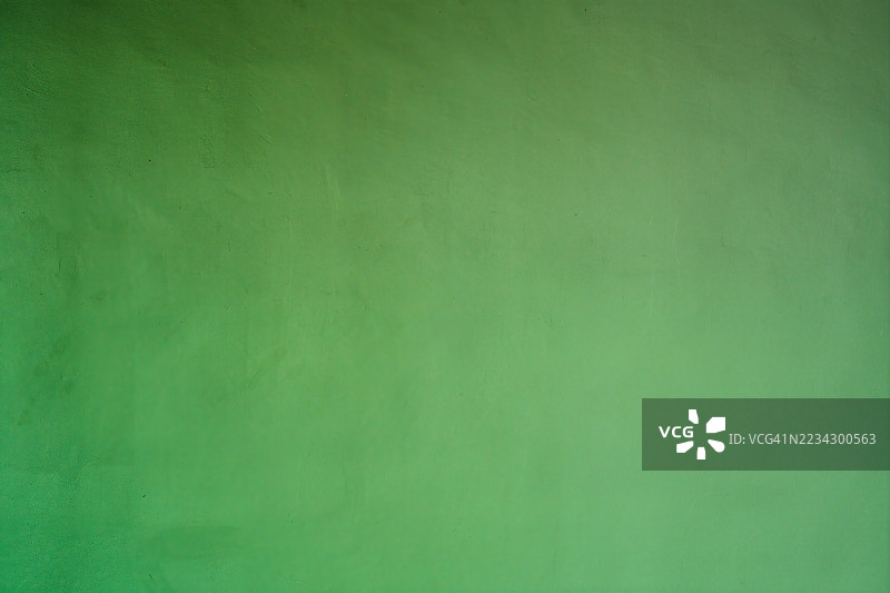 绿色混凝土墙背景纹理，展现粗糙表面图片素材