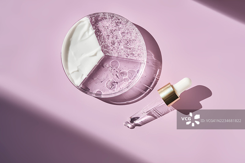 粉色背景上的护肤产品图片素材