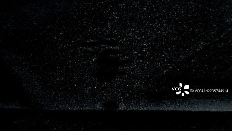 黑色粗糙表面纹理上的微妙暗斑，像银河一样图片素材
