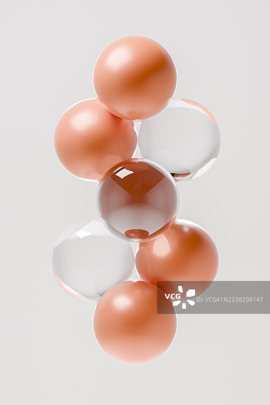 抽象的漂浮玻璃和橙色弹珠在简约背景上图片素材