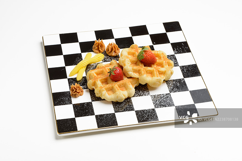 比利时华夫饼配蜂蜜酱和覆盆子图片素材