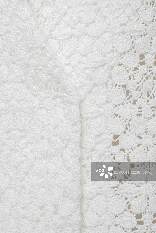 白色蕾丝花卉图案特写，适用于婚礼和时尚的优雅新娘面料纹理图片素材