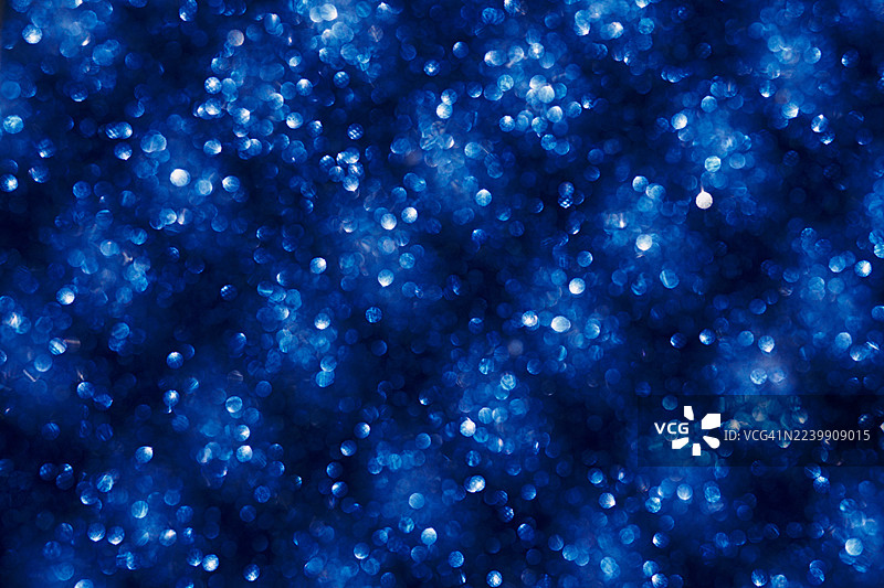 闪耀光芒柔焦的蓝色散景灯光抽象背景图片素材