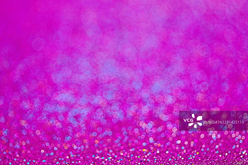 充满活力的粉色闪光背景，带有紫色散景，适合魅力、派对和庆祝活动。图片素材
