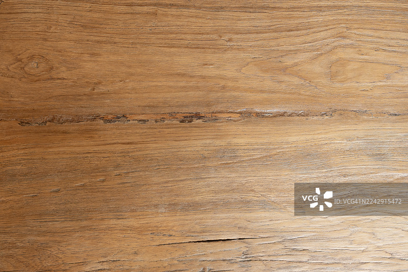 带有纹理图案的木质表面，木纹清晰可见，木材呈棕色。图片素材