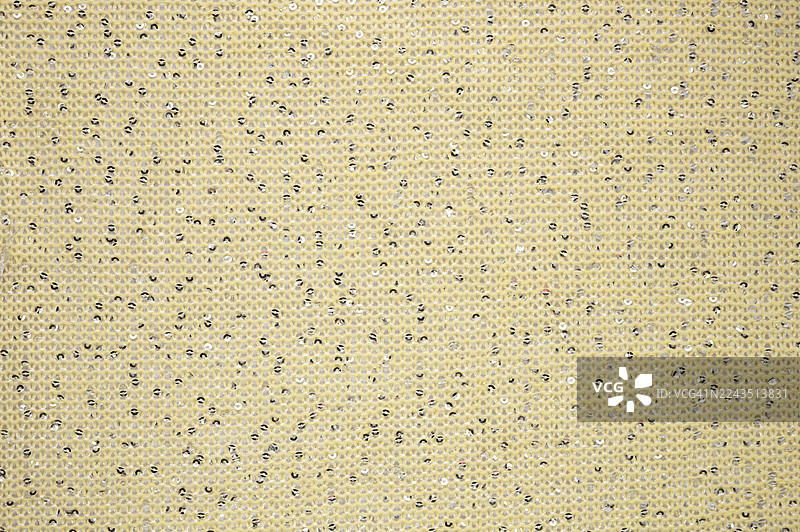 带有方形图案的金属亮片面料。图片素材