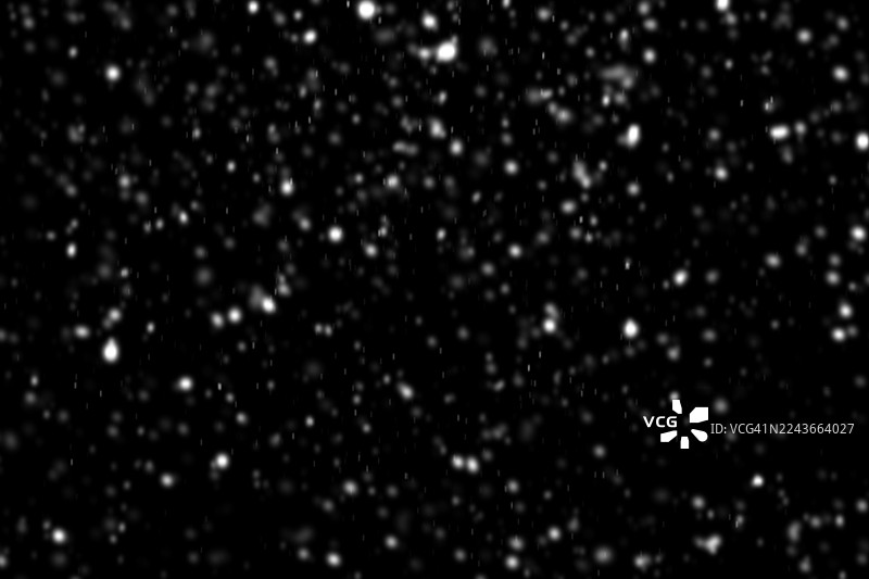 黑色背景上的飘落雪花图片素材