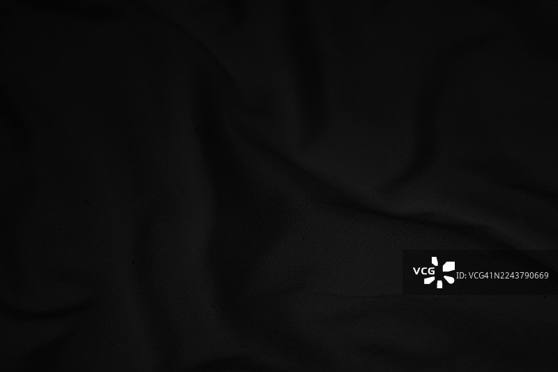 柔软有光泽的黑色织物表面纹理图片素材