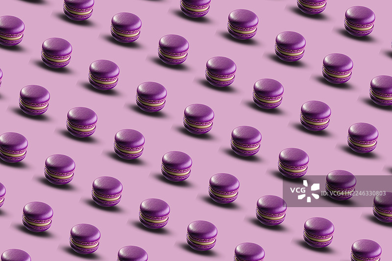 粉色背景下的覆盆子马卡龙重复图案图片素材