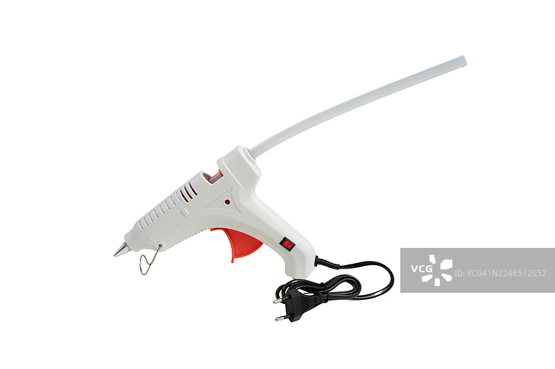 用于DIY手工制作的电动热熔胶枪，白色背景上隔离。图片素材