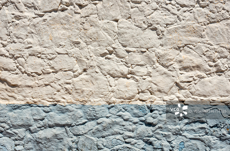 表面粗糙的白色和蓝色纹理石墙图片素材