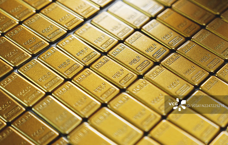 金条堆叠的特写，凸显贵金属的价值和财富保值功能。图片素材