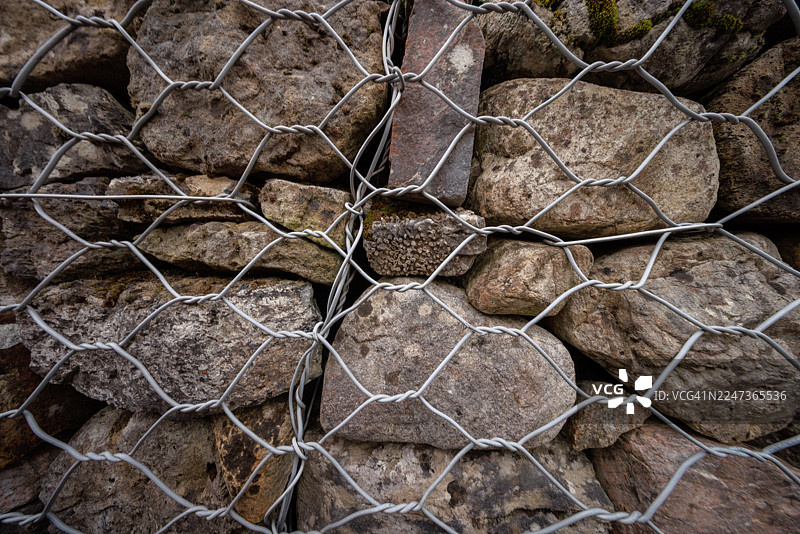 凯罗莫尔墓地围栏的岩石和网状图案图片素材