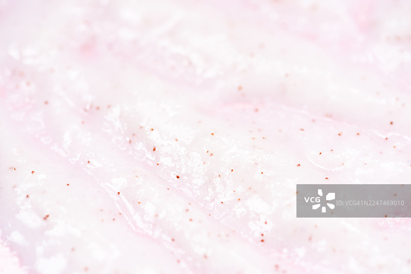 质感细腻的白色砂糖磨砂膏特写，含有天然去角质成分图片素材