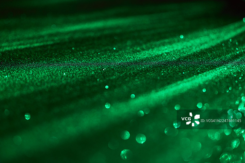 闪亮的绿色抽象背景，带有亮片图片素材
