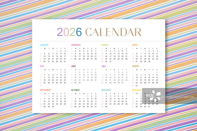 2026年年历折叠在彩色背景的A4纸上图片素材