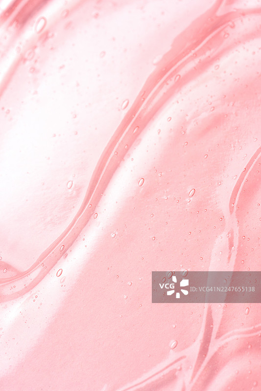 带有气泡的粉色液体凝胶质地，展示了清晰的化妆品图片素材