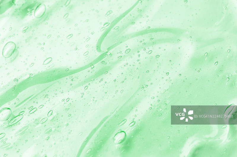 浅色背景上带有气泡的绿色凝胶质感图片素材