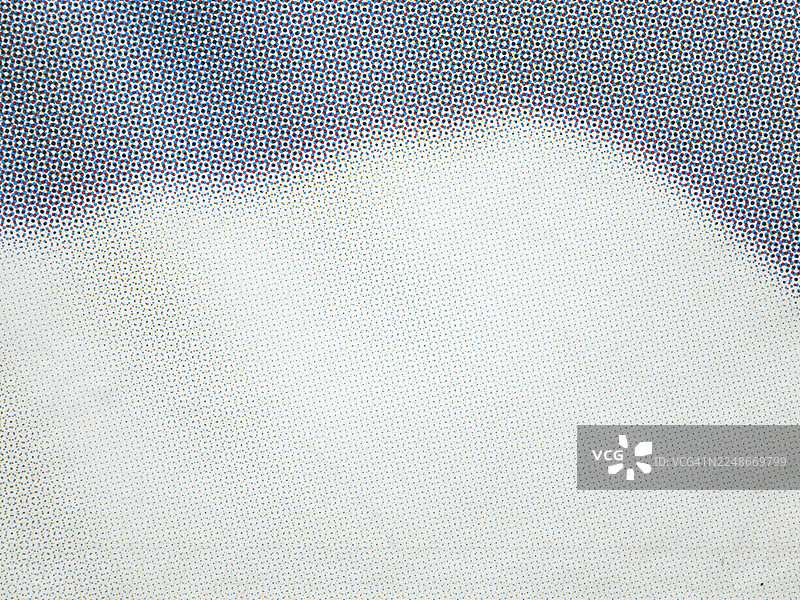 白色纸上印有蓝色、红色、黑色和黄色圆点的特写。图片素材