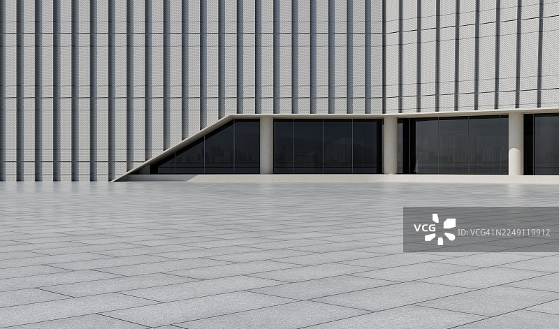 带有穿孔垂直外墙和倾斜结构线条的现代建筑图片素材