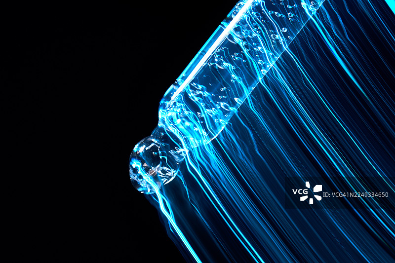 移液器抽取蓝色血清，生物技术与化妆品科学图片素材