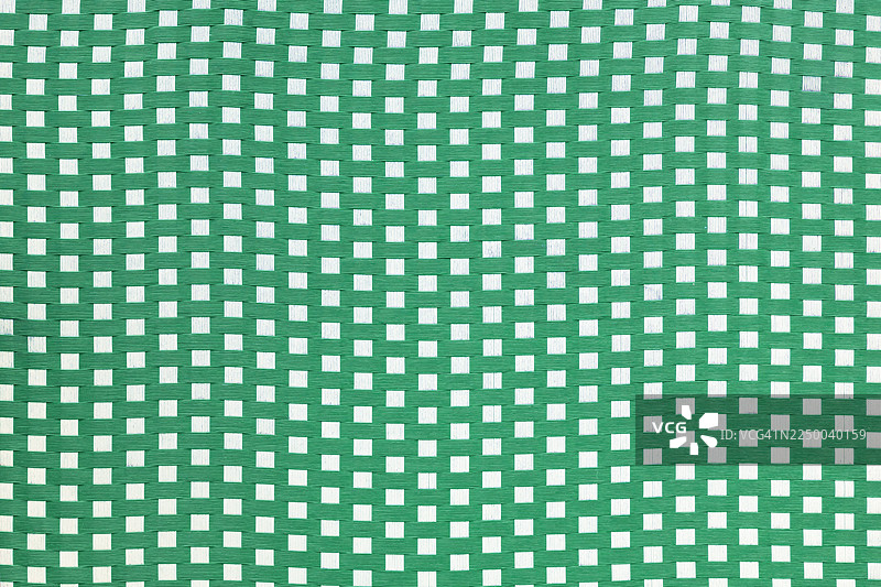 编织纹理的白色和绿色皮革材质，抽象背景。图片素材