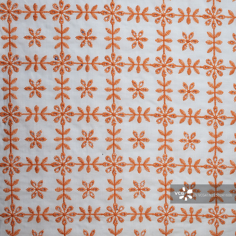 全画幅拍摄的橙色刺绣蕾丝面料图片素材