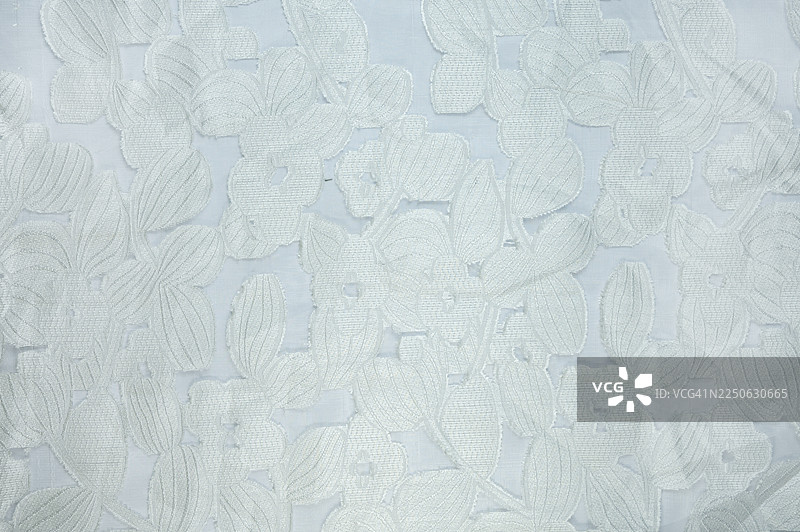 白色刺绣蕾丝面料的特写镜头图片素材