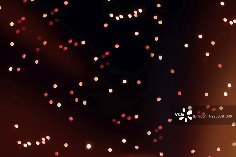 夜晚的抽象灯光，多彩的光点，光线反射，散景，背景图图片素材