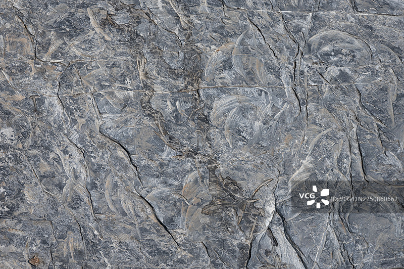 灰色的颗粒状石墙，带有抽象图案图片素材