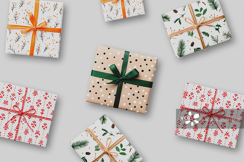 圣诞礼物俯视角度整齐排列，非常适合网页、博客、传单或横幅。时尚、节日和明亮的布局，非常适合假日创意项目。图片素材