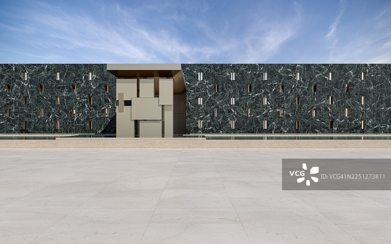 带有深色大理石外墙和几何入口的现代建筑图片素材