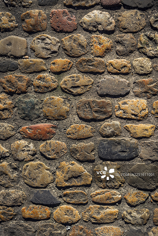 具有铺路石纹理的历史悠久的墙壁图片素材