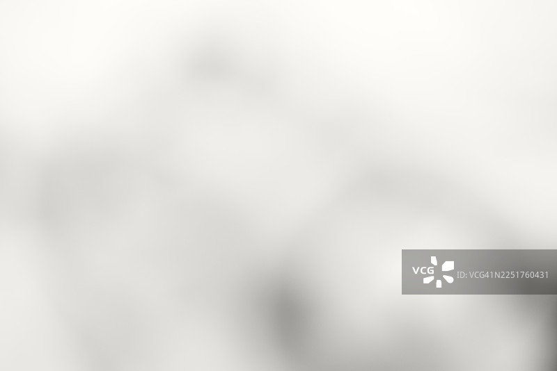 柔和抽象的奶油灰色调模糊，带有微妙光影的宁静极简纹理，适用于背景、设计项目和创意演示图片素材