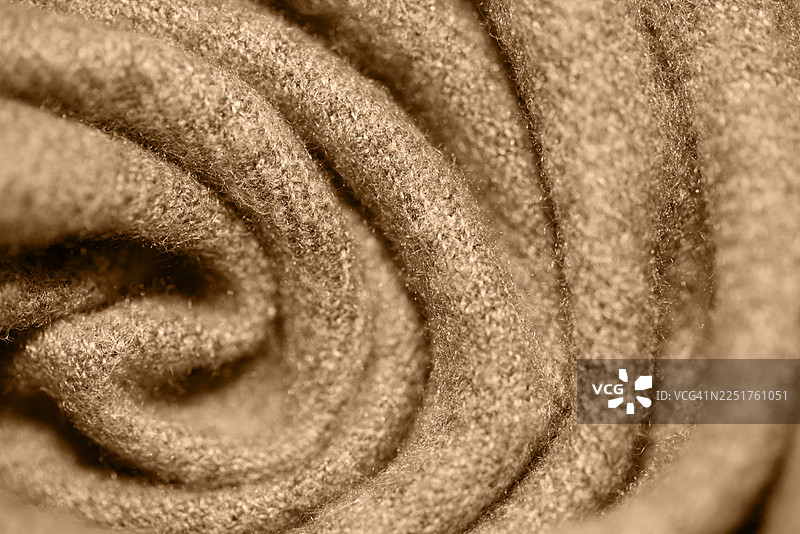 近景棕褐色调的绒面皮革绳编织纹理，富有温暖感和柔和的细节图片素材