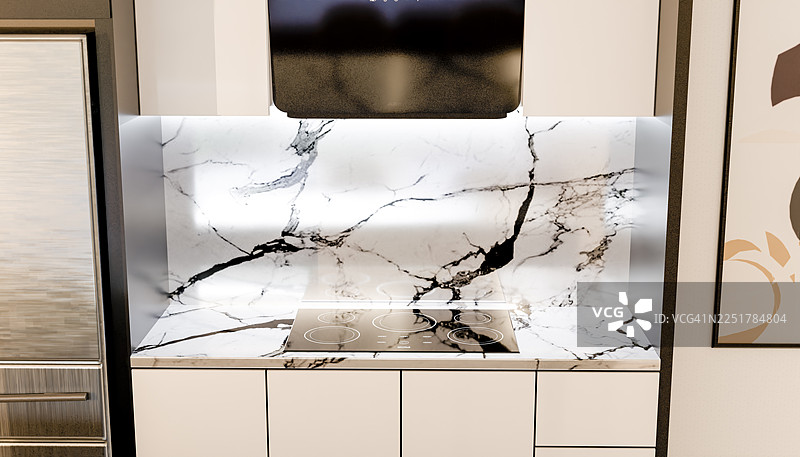 现代厨房内部，配有大理石台面和电磁炉图片素材
