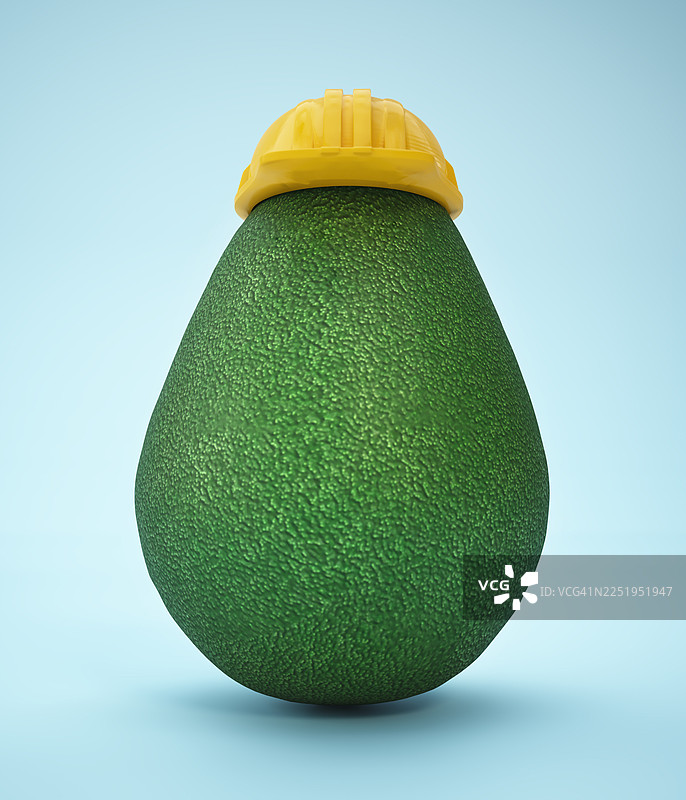 戴着黄色安全帽的牛油果，背景为浅蓝色。保护概念图片素材