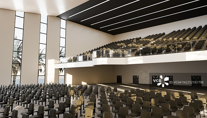 空旷的现代礼堂内部，展示着一排排座位和阳台图片素材