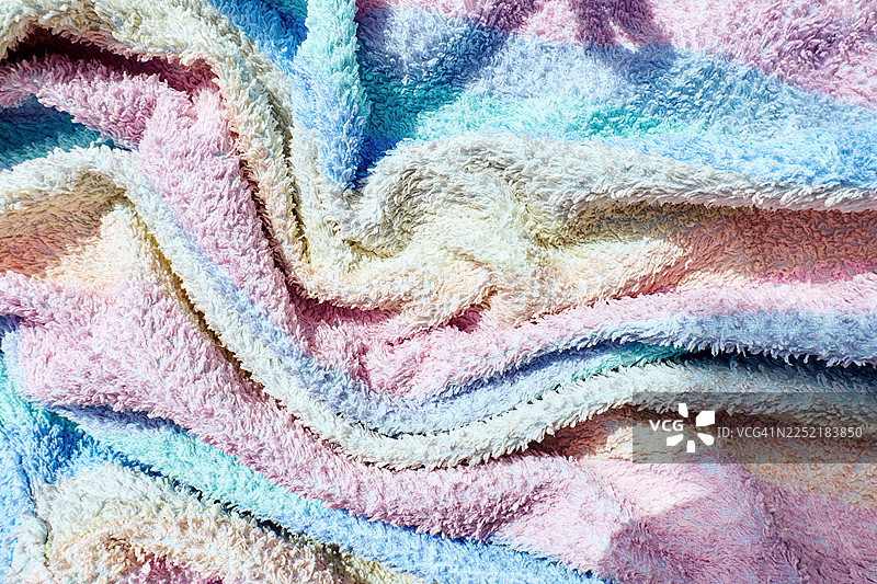 色彩柔和的彩虹背景，带有美丽的毛巾纹理。图片素材