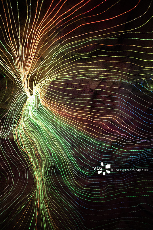 带有纹理的蓝色背景上的抽象绿色和红色光效图片素材