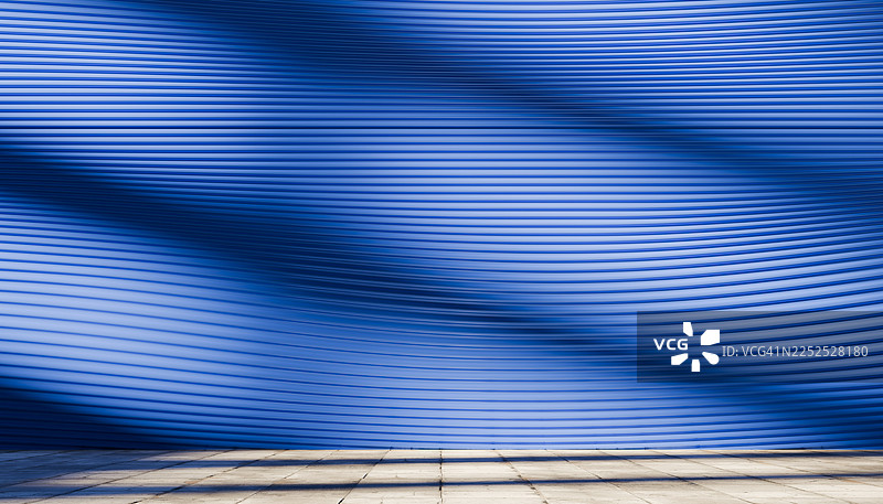 蓝色的波浪形墙壁，带有抽象的阴影图案图片素材
