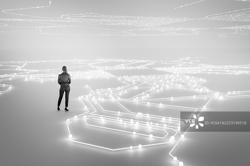 一位女商人站在虚拟现实环境中图片素材