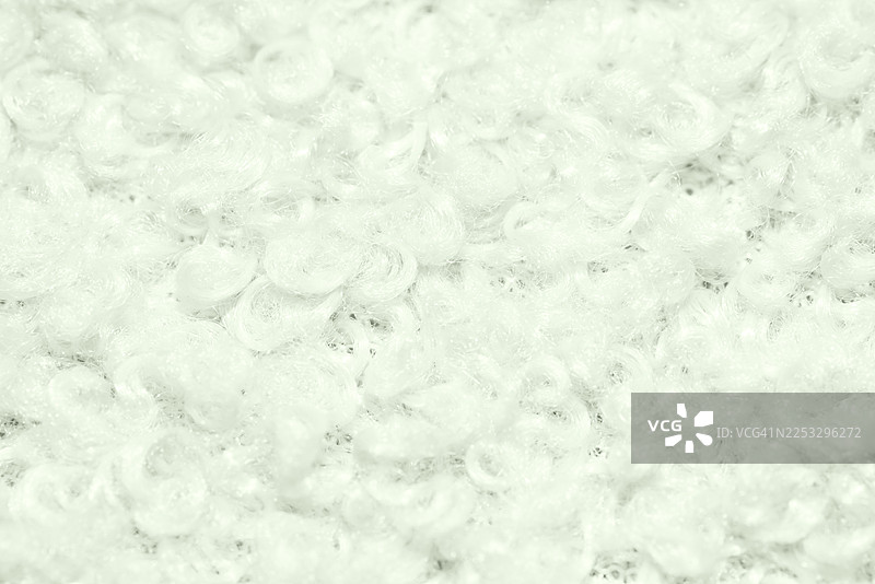 柔软的白色羊毛纹理特写，适合针织、手工艺和家居装饰等温馨舒适的项目图片素材