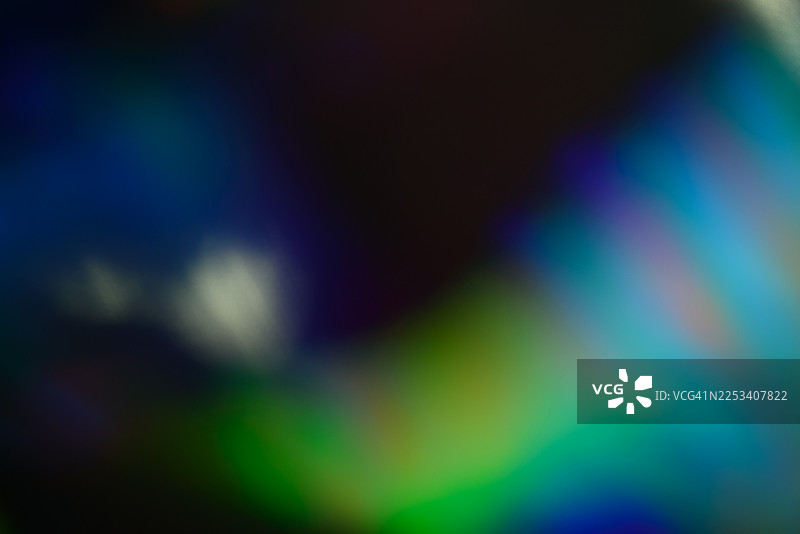 充满活力的抽象光线漩涡，深邃的蓝绿色调，营造出梦幻般的氛围，适用于创意和现代项目图片素材