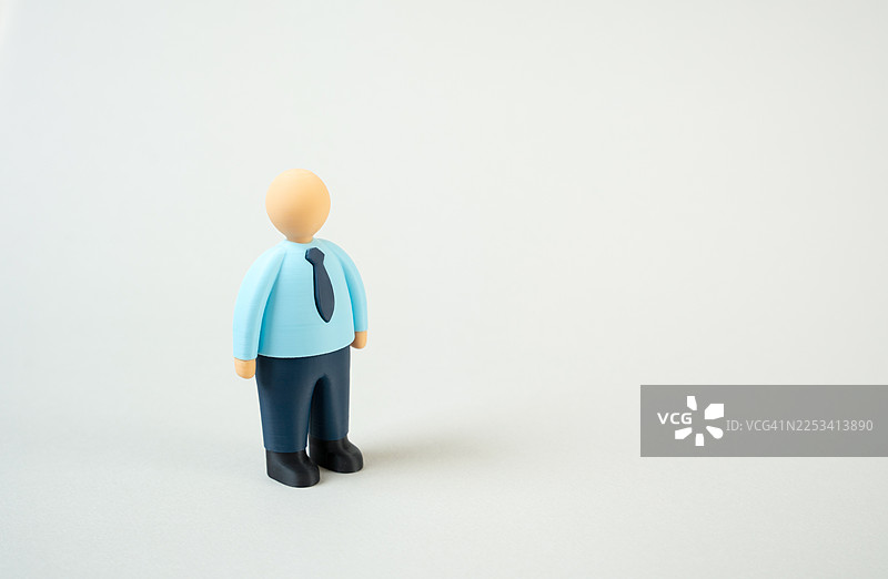 一个打扮成商人的玩偶，背景是白色的图片素材