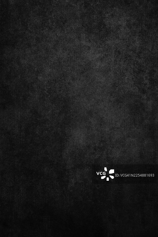 带有做旧表面的黑色粗糙纹理背景，戏剧性的暗角效果，以及充足的复制空间图片素材